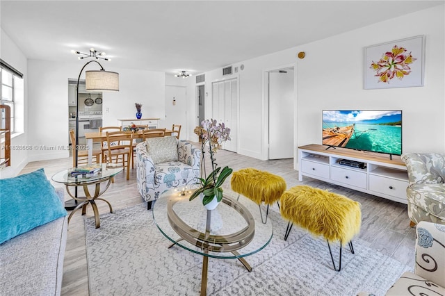 4141 Nautilus Dr Unit 7J, Miami Beach, FL 33140 - living room featuring wood finished floors and baseboards