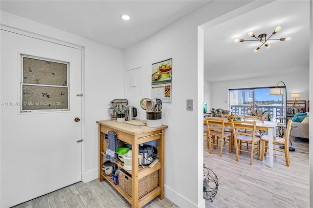 4141 Nautilus Dr Unit 7J, Miami Beach, FL 33140 - foyer entrance with light wood-style flooring and recessed lighting