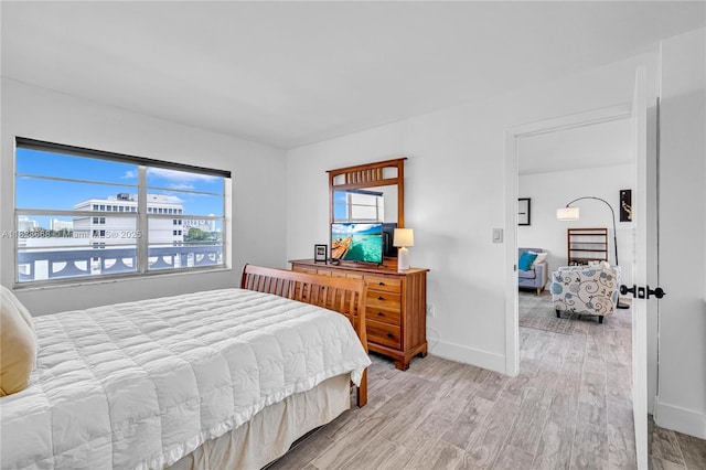 4141 Nautilus Dr Unit 7J, Miami Beach, FL 33140 - bedroom with multiple windows and light wood-style floors