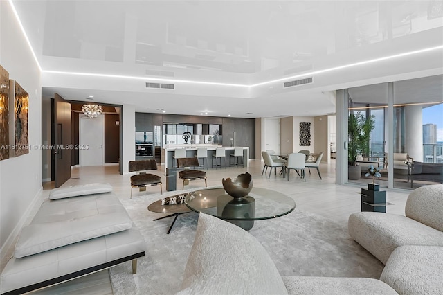 851 NE 1st Ave Unit Ph4912, Miami, FL 33132 - living room with a chandelier and light tile patterned flooring