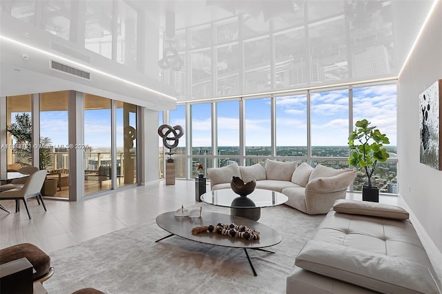 851 NE 1st Ave Unit Ph4912, Miami, FL 33132 - living area with a towering ceiling, tile patterned floors, and expansive windows