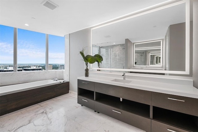 851 NE 1st Ave Unit Ph4912, Miami, FL 33132 - bathroom with vanity, a garden tub, marble finish floors, and a shower