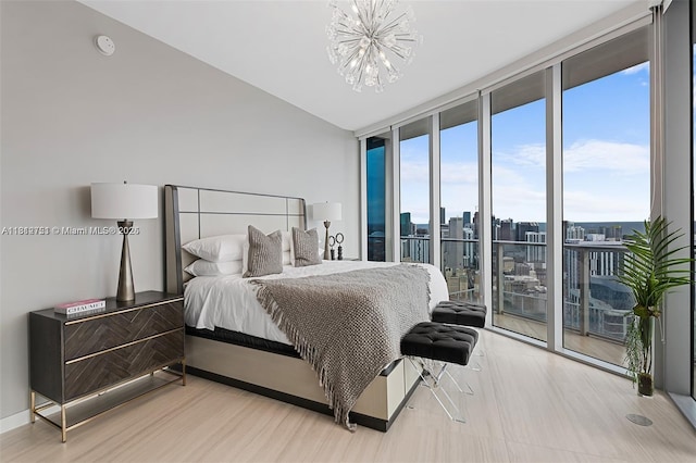 851 NE 1st Ave Unit Ph4912, Miami, FL 33132 - bedroom featuring expansive windows, access to exterior, a chandelier, and a city view