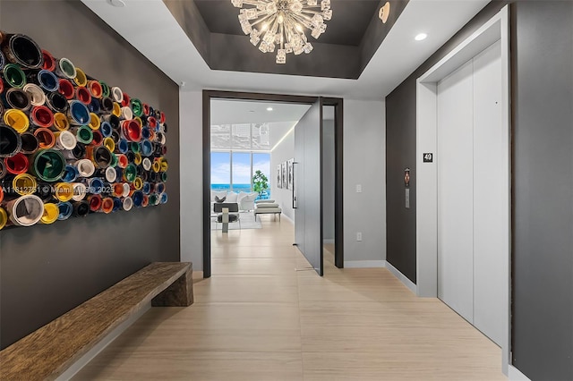 851 NE 1st Ave Unit Ph4912, Miami, FL 33132 - hallway with a chandelier, floor to ceiling windows, elevator, and recessed lighting