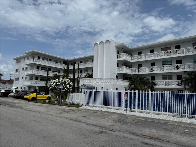 11685 Canal Dr Unit 303, North Miami, FL 33181 - view of apartment building / complex featuring uncovered parking