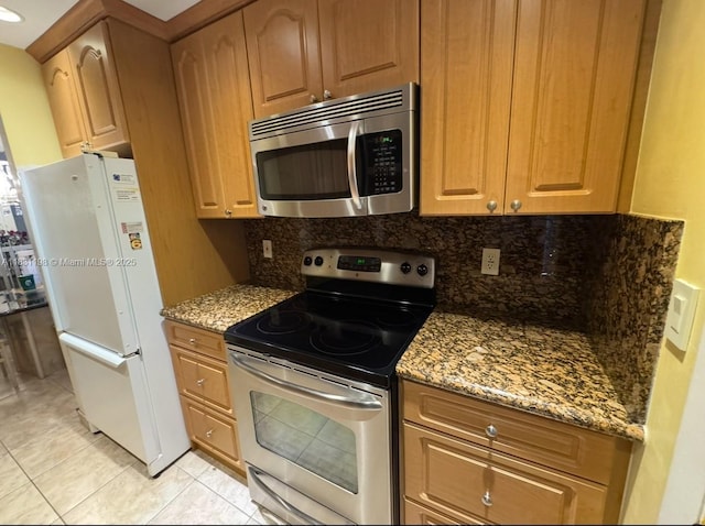 11685 Canal Dr Unit 303, North Miami, FL 33181 - kitchen featuring stainless steel appliances, backsplash, stone countertops, and light tile patterned floors