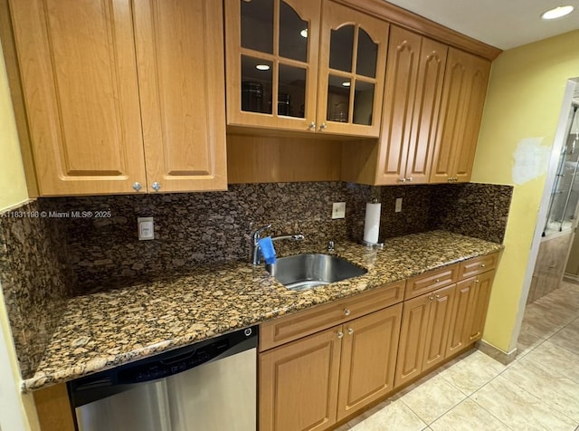 11685 Canal Dr Unit 303, North Miami, FL 33181 - kitchen with dishwasher, decorative backsplash, dark stone counters, and glass insert cabinets