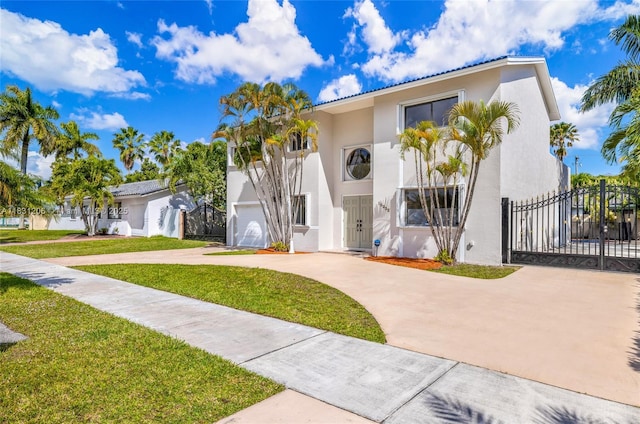 15235 SW 99th Ct, Miami, FL 33157 - mediterranean / spanish-style house with driveway, stucco siding, and a gate
