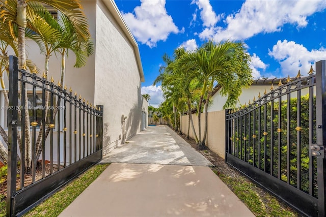 15235 SW 99th Ct, Miami, FL 33157 - view of home's exterior with stucco siding and a gate
