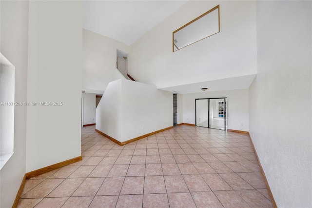 15235 SW 99th Ct, Miami, FL 33157 - spare room with a high ceiling and light tile patterned floors