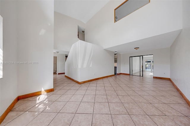 15235 SW 99th Ct, Miami, FL 33157 - empty room featuring a towering ceiling and light tile patterned flooring
