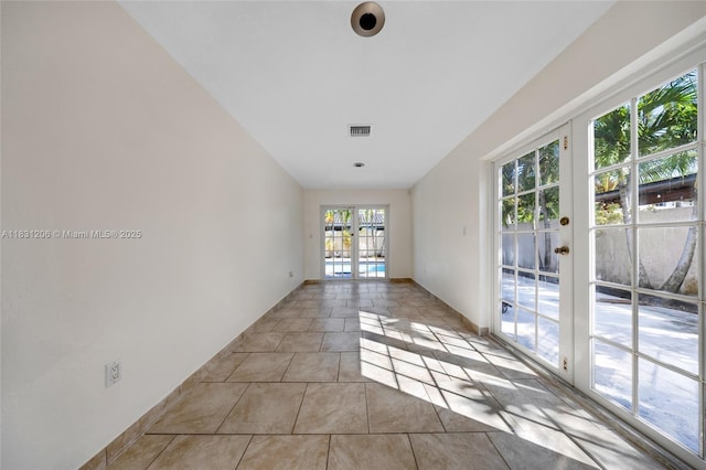 15235 SW 99th Ct, Miami, FL 33157 - spare room featuring french doors and light tile patterned flooring