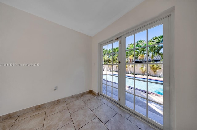 15235 SW 99th Ct, Miami, FL 33157 - empty room featuring light tile patterned flooring and french doors