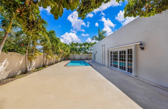 15235 SW 99th Ct, Miami, FL 33157 - view of swimming pool featuring a patio area and a fenced backyard