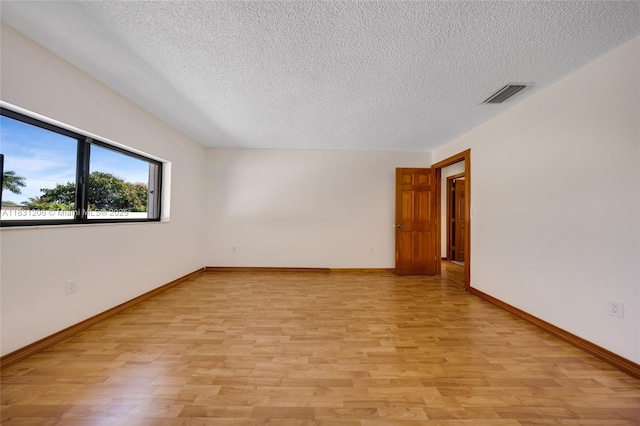 15235 SW 99th Ct, Miami, FL 33157 - unfurnished room with light wood finished floors and a textured ceiling