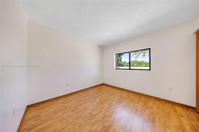 15235 SW 99th Ct, Miami, FL 33157 - unfurnished room featuring light wood-type flooring and a textured ceiling