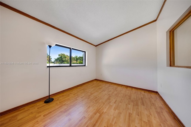 15235 SW 99th Ct, Miami, FL 33157 - spare room featuring crown molding, light wood-style floors, and a textured ceiling
