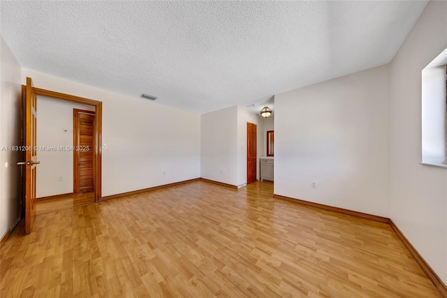 15235 SW 99th Ct, Miami, FL 33157 - unfurnished room with light wood finished floors and a textured ceiling