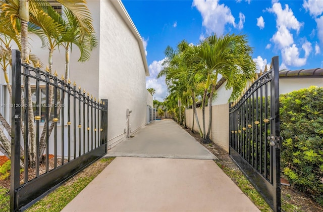 15235 SW 99th Ct, Miami, FL 33157 - view of side of property featuring a gate and stucco siding