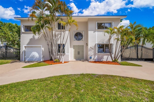 15235 SW 99th Ct, Miami, FL 33157 - mediterranean / spanish-style home featuring concrete driveway, stucco siding, a garage, and a gate