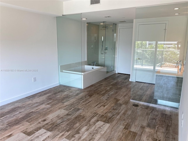 650 NE 32nd St Unit 802, Miami, FL 33137 - bathroom with wood finished floors, a garden tub, and a shower stall