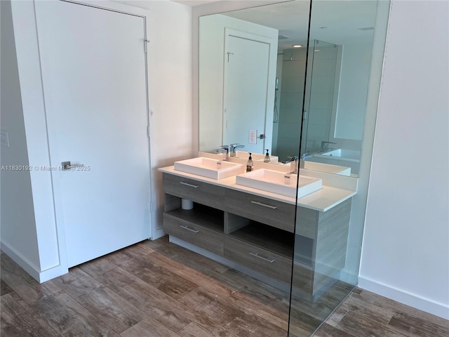 650 NE 32nd St Unit 802, Miami, FL 33137 - full bathroom with double vanity, wood finished floors, and an enclosed shower