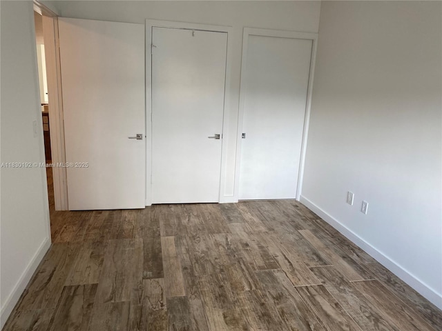 650 NE 32nd St Unit 802, Miami, FL 33137 - unfurnished bedroom with wood finished floors and baseboards