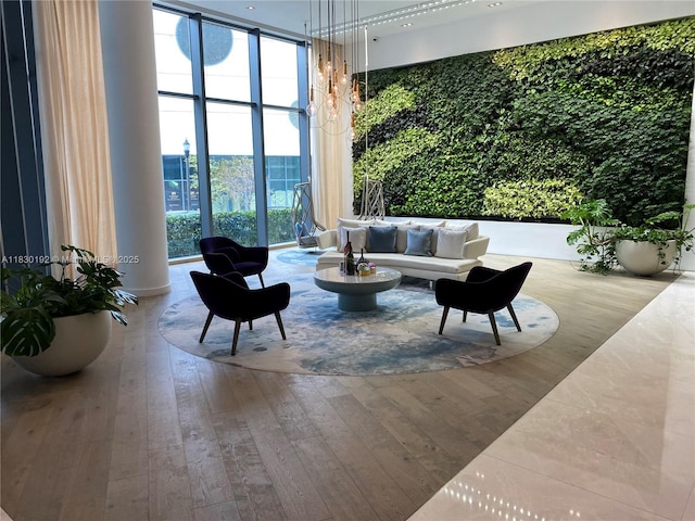 650 NE 32nd St Unit 802, Miami, FL 33137 - building lobby featuring floor to ceiling windows and a high ceiling