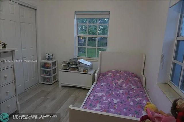 771 E 35th St, Hialeah, FL 33013 - bedroom featuring wood finished floors and a closet
