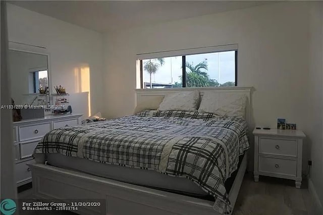 771 E 35th St, Hialeah, FL 33013 - bedroom featuring wood finished floors and baseboards