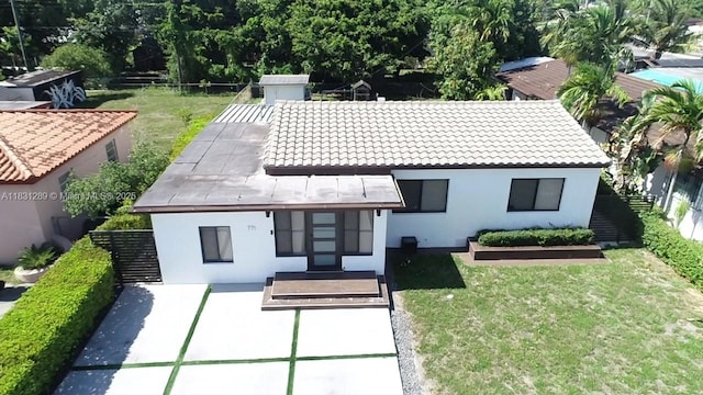 771 E 35th St, Hialeah, FL 33013 - back of property featuring stucco siding and a tiled roof