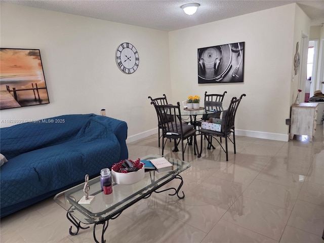 4720 NW 114th Ave Unit 206, Doral, FL 33178 - living room featuring a textured ceiling and baseboards