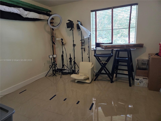 4720 NW 114th Ave Unit 206, Doral, FL 33178 - exercise area featuring baseboards and tile patterned floors