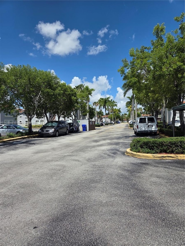 4720 NW 114th Ave Unit 206, Doral, FL 33178 - view of asphalt street with curbs and a residential view