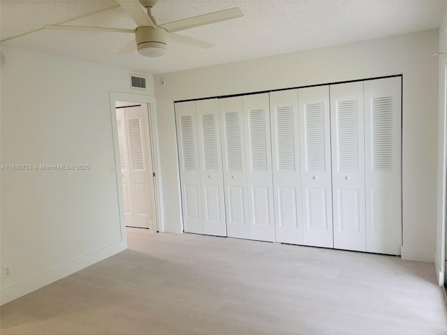 4025 Ellesmere B 4025, Deerfield Beach, FL 33442 - unfurnished bedroom with light wood-style floors, a closet, and ceiling fan
