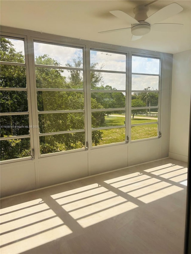 4025 Ellesmere B 4025, Deerfield Beach, FL 33442 - unfurnished sunroom with healthy amount of natural light and a ceiling fan