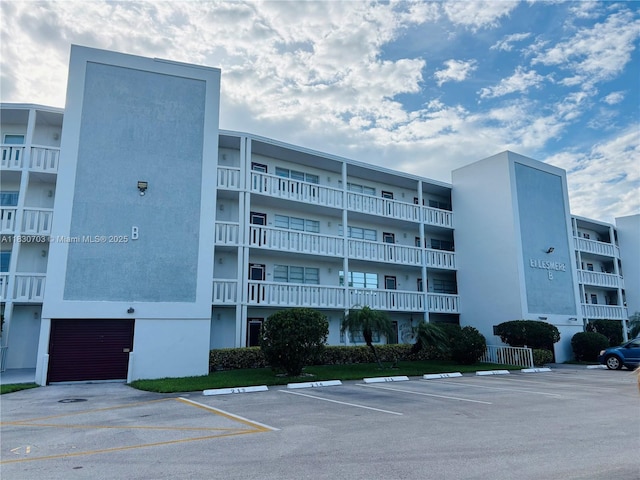 4025 Ellesmere B 4025, Deerfield Beach, FL 33442 - view of apartment building / complex featuring uncovered parking