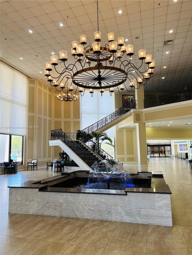4025 Ellesmere B 4025, Deerfield Beach, FL 33442 - community lobby with a towering ceiling, stairs, and recessed lighting