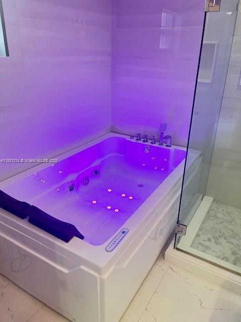 15271 NW 6th Ct, Pembroke Pines, FL 33028 - bathroom featuring marble look tiles, a stall shower, and a garden tub