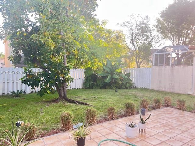 15271 NW 6th Ct, Pembroke Pines, FL 33028 - fenced backyard with a patio area