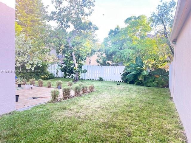 15271 NW 6th Ct, Pembroke Pines, FL 33028 - fenced backyard with a patio area