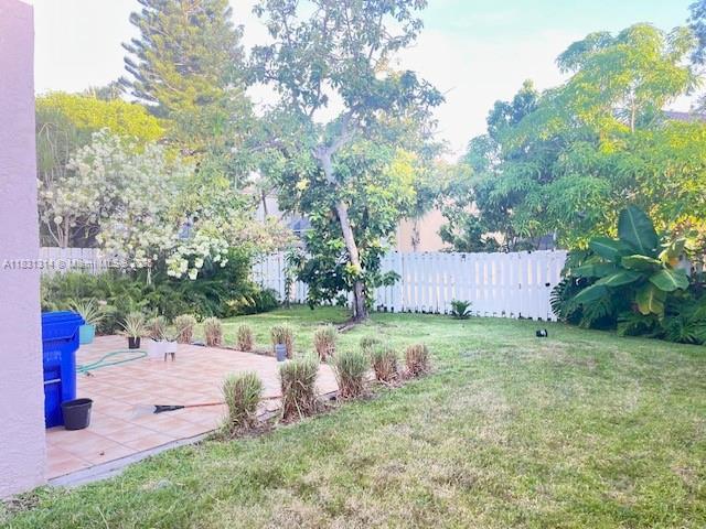 15271 NW 6th Ct, Pembroke Pines, FL 33028 - fenced backyard featuring a patio
