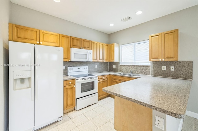 3156 NE 4th St, Homestead, FL 33033 - kitchen featuring white appliances, a peninsula, decorative backsplash, recessed lighting, and light tile patterned floors