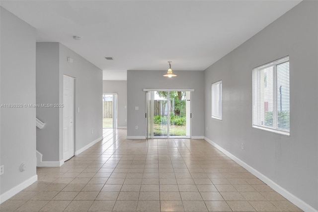 3156 NE 4th St, Homestead, FL 33033 - spare room with light tile patterned floors and a smoke detector