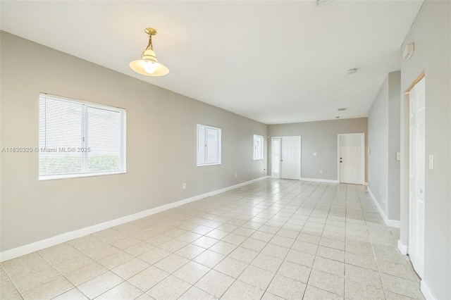 3156 NE 4th St, Homestead, FL 33033 - empty room featuring light tile patterned floors and baseboards