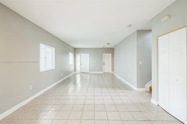 3156 NE 4th St, Homestead, FL 33033 - empty room with baseboards and light tile patterned floors