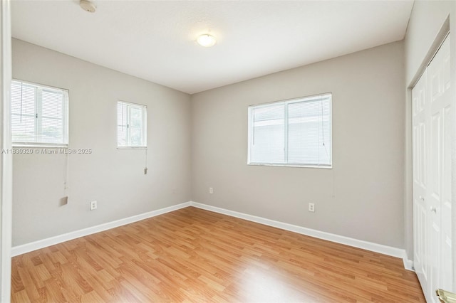 3156 NE 4th St, Homestead, FL 33033 - unfurnished bedroom featuring a closet and light wood-style floors