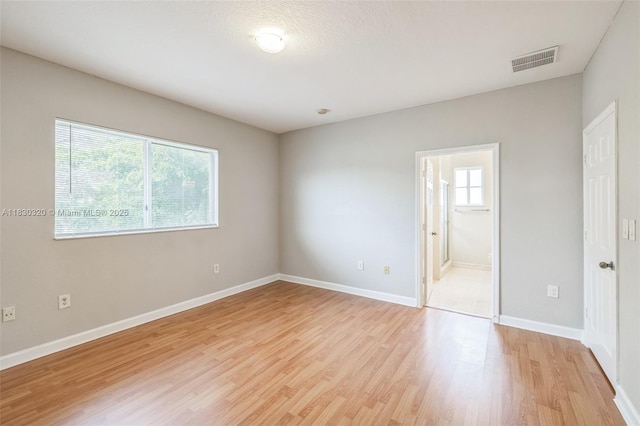 3156 NE 4th St, Homestead, FL 33033 - unfurnished bedroom featuring light wood-style flooring and ensuite bathroom
