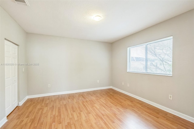 3156 NE 4th St, Homestead, FL 33033 - unfurnished bedroom featuring light wood-style flooring