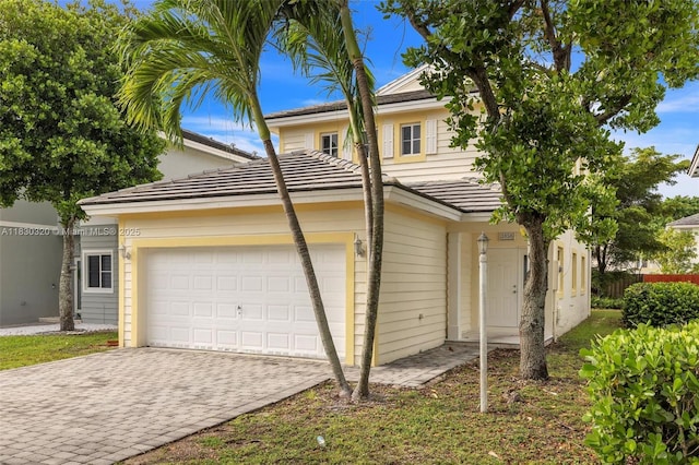 3156 NE 4th St, Homestead, FL 33033 - view of front of house with driveway, a garage, and a tiled roof